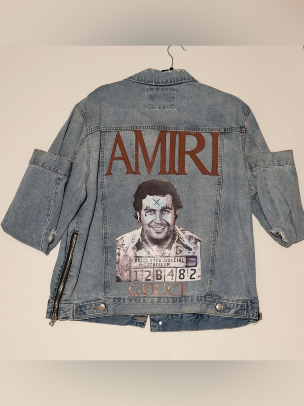 Light Blue Denim Jacket with Brown AMIRI Logo and Graphic Back